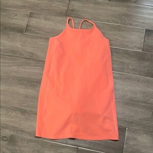 Vibrant Coral Athleta girl dress with shorts.